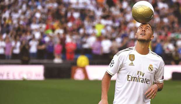 Eden Hazard showed off his skills to the fans at the Bernabeu, with his move to Real Madrid now signed and sealed. (AFP)