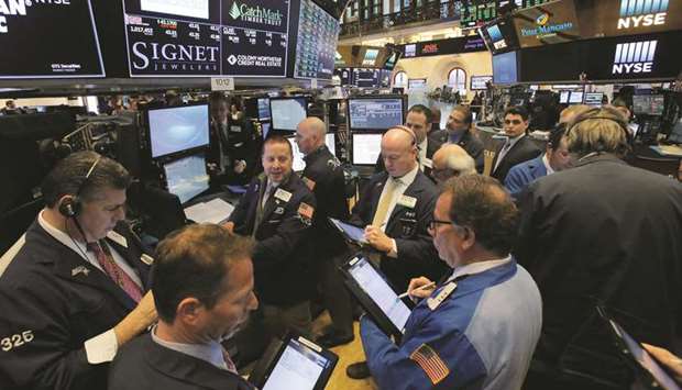 Traders work at the New York Stock Exchange (file). The Federal Open Market Committee meeting this week is shaping up as a pivotal one for Wall Street, with stocks primed for a selloff should the Fed fail to take an even more dovish tilt after policymakers raised expectations for a rate cut in recent weeks.