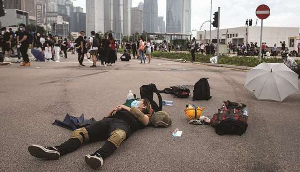 A protester rests on Lung Wo Road during a protest against a proposed extradition law in Hong Kong. While the demonstrations over the law are still at an early stage compared with the Occupy movement that froze the Central District in 2014, the cityu2019s external headwinds are higher and growth has already slowed to the weakest since the 2009 financial crisis.