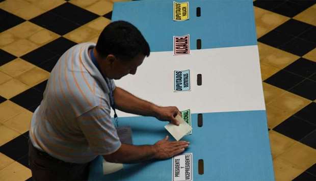 Guatemala's Supreme Electoral Tribunal workers set up a polling station in Guatemala City