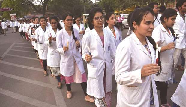 Junior doctors of SRN Hospital participate in a march to protest against the assault on doctors in West Bengal yesterday.