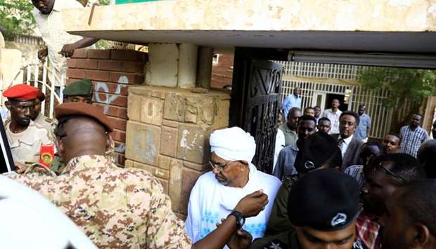 Sudan's ex-president Omar al-Bashir leaves the office of the anti-corruption prosecutor in Khartoum