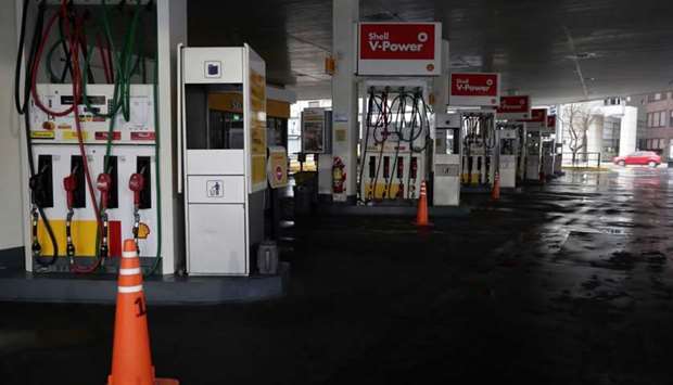 View of a closed gas station in downtown Buenos Aires on June 16, 2019 during a power cut. A massive outage blacked out Argentina and Uruguay Sunday, leaving both South American countries without electricity, power companies said