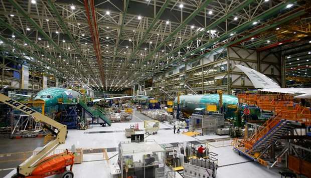 Several Boeing 777X aircraft are seen in various stages of production during a media tour of the Boeing 777X at the Boeing production facility in Everett, Washington