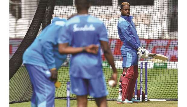 West Indiesu2019 Shimron Hetmyer (right) bats in the nets during a training session at The County Ground in Taunton, England, yesterday. (AFP)