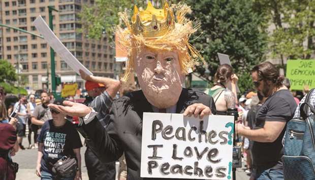 Protestors attend a demonstration calling for the impeachment of President Donald Trump in New York City on Saturday. Major cities across the country held u201c#ImpeachTrump Day of Actionu201d protests on Saturday to demand that Congress begin impeachment proceedings against the president.