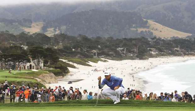 Gary Woodland of the United States lines up a putt on the 13th green during the third round of the 2019 US Open at Pebble Beach Golf Links in Pebble Beach, California.
