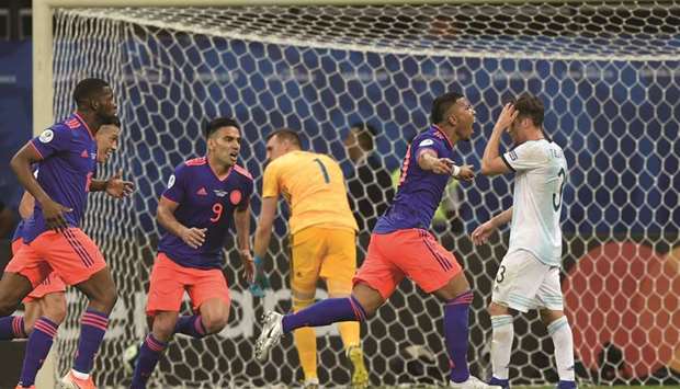 Colombiau2019s Roger Martinez (second from right) celebrates after scoring against Argentina during their Copa America match at the Fonte Nova Arena in Salvador, Brazil, on Saturday. (AFP)