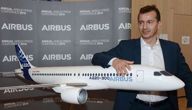 Airbus Commercial Aircraft Business Guillaume Faury poses next to an Airbus plane model