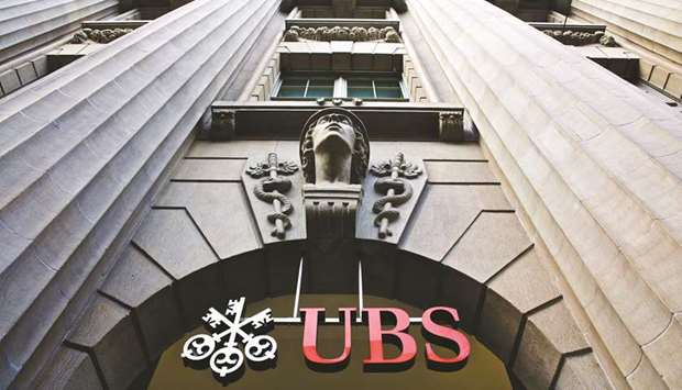 A sign hangs above the entrance to UBS headquarters in Zurich.