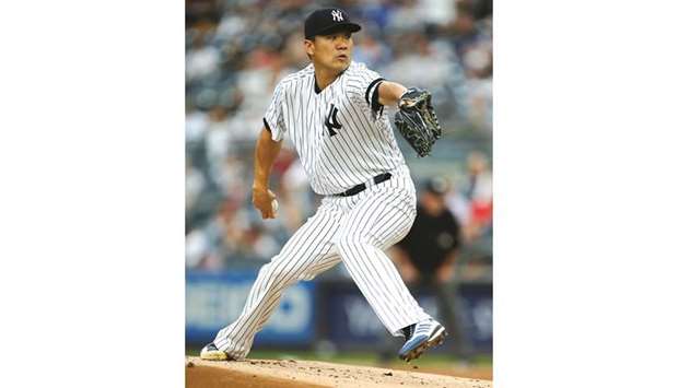 New York Yankees starting pitcher Masahiro Tanaka (19) pitches against the Tampa Bay Rays in New York on Monday. (USA TODAY Sports)