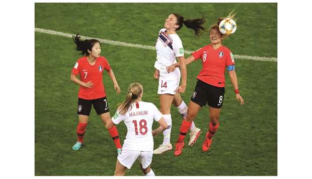 South Koreau2019s Cho Sohyun (right) and Norwayu2019s Ingrid Syrstad go for a header during the Womenu2019s World Cup Group A match in Reims, France, on Monday. (Reuters)