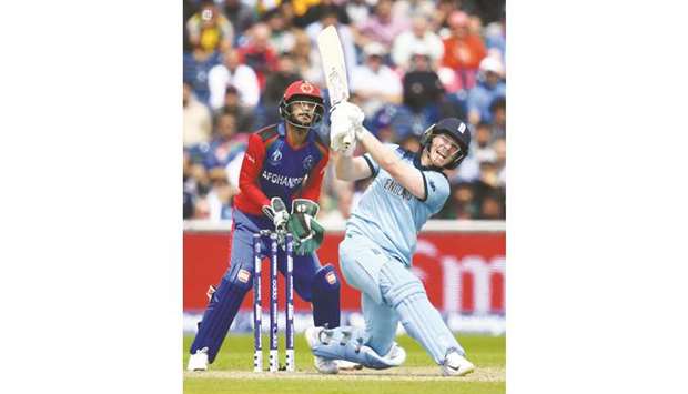 Englandu2019s captain Eoin Morgan (right) plays a shot during the 2019 ICC Cricket World Cup match against Afghanistan at Old Trafford in Manchester, United Kingdom, yesterday. (AFP)