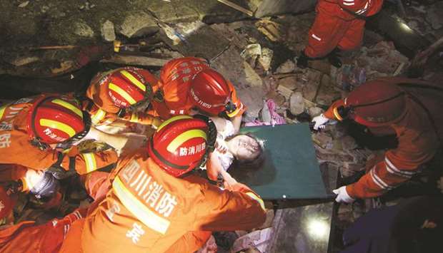 Rescue workers search for survivors after earthquakes hit Changning county in Yibin, Sichuan province, China.