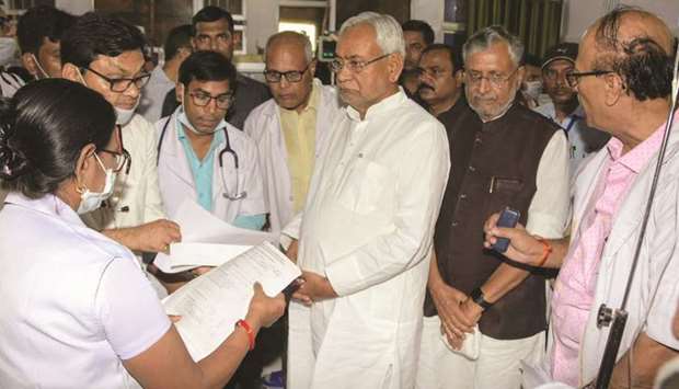 Bihar Chief Minister Nitish Kumar speaks with doctors at a hospital where children suffering from encephalitis are undergoing treatment, in Muzaffarpur yesterday.