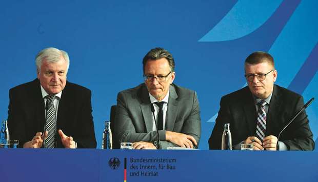 (From left) German Interior Minister Horst Seehofer, president of the German Federal Criminal Police Office Holger Muench and president of Germanyu2019s domestic intelligence agency (Bundesamt fuer Verfassungsschutz), Thomas Haldenwang give a press conference in Berlin yesterday.