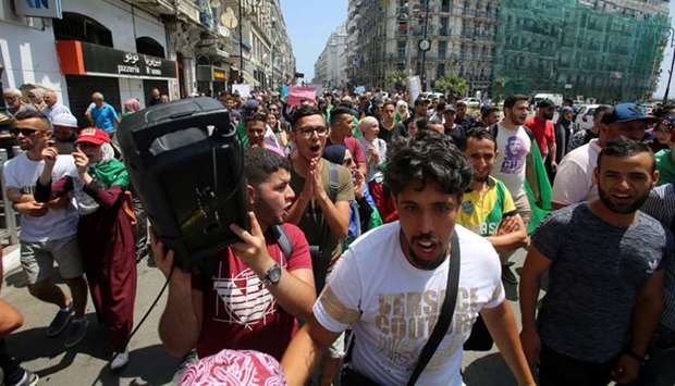 Students march during an anti-government protest in Algiers, yesterday.