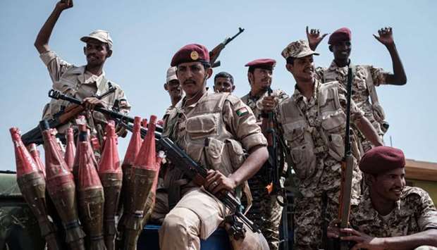 Members of Sudan's Rapid Support Forces (RSF) paramilitaries led by General Mohamed Hamdan Dagalo, also known as Himediti, deputy head of Sudan's ruling Transitional Military Council (TMC) and commander of the RSF paramilitaries, stand guard during the General's meeting with his supporters in the capital Khartoum yesterday.