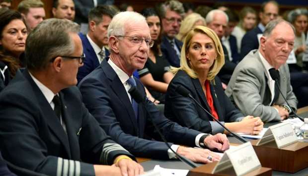 Retired Airline Captain Chesley ,Sully, Sullenberger (2nd, L) makes remarks as (L-R) Capt. Dan Carey of the Allied Pilots Association, Sara Nelson of the Association of Flight Attendants and former Federal Aviation Administration Administrator Randy Babbitt listen during a House Transportation and Infrastructure Aviation Subcommittee hearing on the status of the Boeing 737 MAX, on Capitol Hill