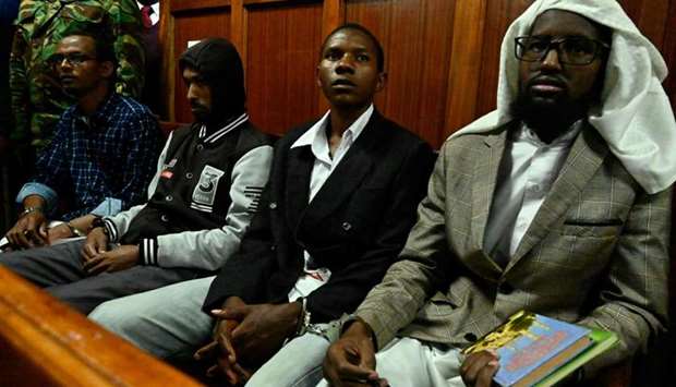 Suspected accomplices (L-R) Hassan Aden Hassan, Mohamed Ali Abdikar, Rashid Charles Mberesero and Sahal Diriye Hussein attend their trial at a Nairobi court