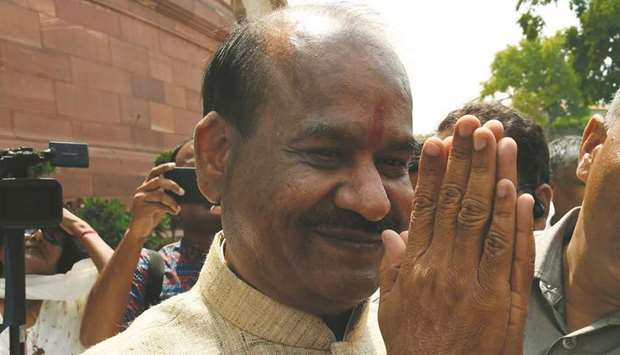 Birla gestures after attending the parliament session in New Delhi yesterday.