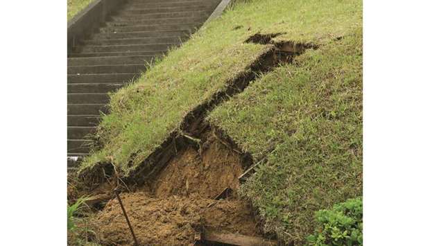 A damaged slope in the city of Murakami, Niigata Prefecture following a 6.4 magnitude earthquake the night before.