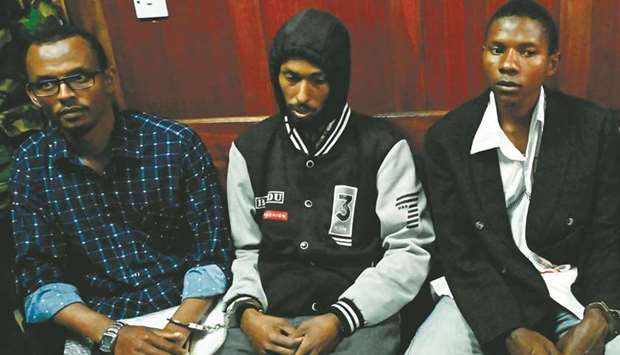 (From left) Suspected accomplices Hassan Aden Hassan, Mohamed Ali Abdikar and Rashid Charles Mberesero sit in the Nairobi court yesterday.