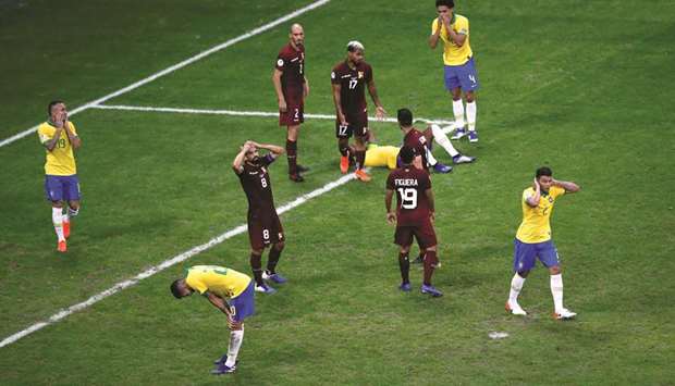 Brazil and Venezuela players react during their Copa America Group A match at the Arena Fonte Nova in Salvador, Brazil on Tuesday night. (Reuters)