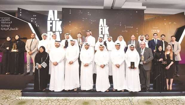 HE the Minister of Commerce and Industry Ali bin Ahmed al-Kuwari with officials and award recipients.