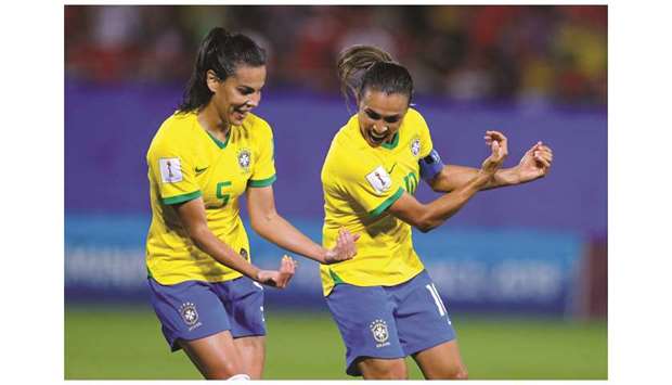 Brazilu2019s Marta (R) celebrates scoring her record World Cup goal against Italy in the Womenu2019s World Cup. At left is Thaisa.