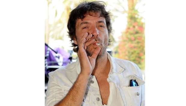 In this file photo taken on April 18, 2010 DJ Philippe Zdar smokes backstage during day three of the Coachella Valley Music & Arts Festival 2010 held at the Empire Polo Club on in Indio, California