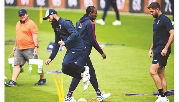 Englandu2019s Moeen Ali (left) jumps over a wicket during a training session at Headingley in Leeds, United Kingdom, yesterday. (AFP)