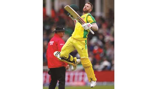 Australiau2019s David Warner celebrates his century during the ICC Cricket World Cup match against Bangladesh in Nottingham, United Kingdom, yesterday. (Reuters)