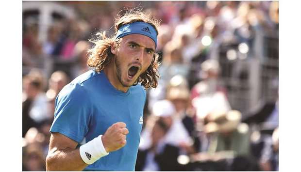 Greeceu2019s Stefanos Tsitsipas celebrates after winning a game against Franceu2019s Jereme Chardy at the ATP Fever-Tree Championships at Queenu2019s Club in London yesterday. (AFP)
