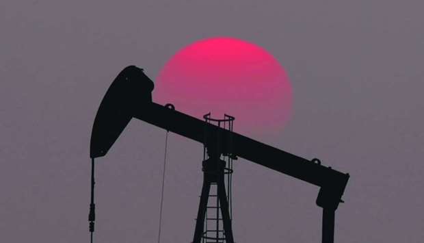 The sun sets behind an oil pump outside Saint-Fiacre, near Paris (file). After three decades of stellar expansion and booming revenues, profit margins at Vitol, Glencore, Trafigura, Gunvor, Mercuria and other merchants have been squeezed by a market again awash with crude and amid stiff competition from national oil firms.