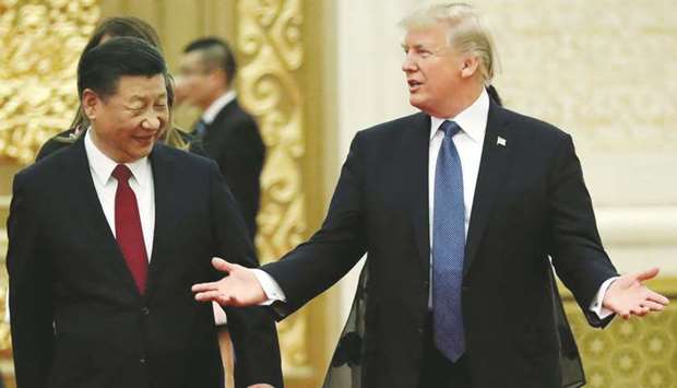 US President Donald Trump and Chinau2019s President Xi Jinping arrive for a state dinner at the Great Hall of the People in Beijing (file).