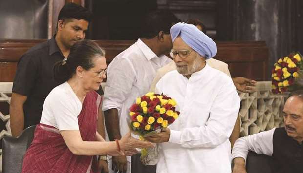Former prime minister Manmohan Singh congratulates Sonia Gandhi after she was elected Congress Parliamentary Party leader at a meeting in New Delhi yesterday.