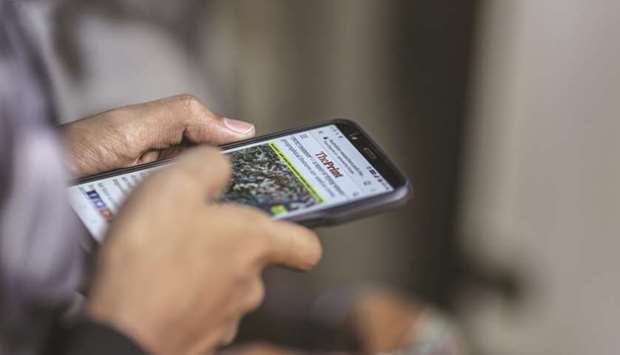 A man reads a news article on a smartphone in Mumbai (file).