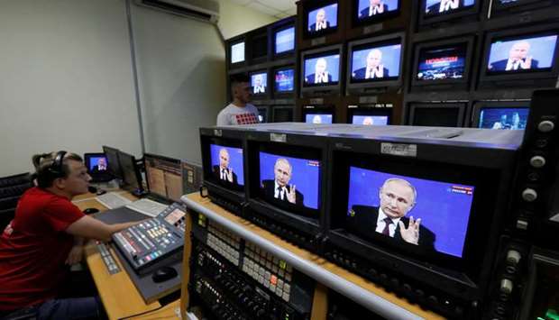 Employees of the Afontovo private regional TV company work during the broadcast of an annual nationwide televised phone-in show attended by President Putin in Krasnoyarsk, Russia.
