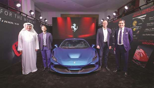 Alfardan Group president and CEO Omar Hussain Alfardan, Italian ambassador Pasquale Salzano and other dignitaries with the all-new Ferrari F8 Tributo. (Supplied picture)
