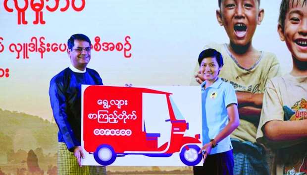 Alok Verma, chief commercial officer of Ooredoo Myanmar, with Thae Nu San.