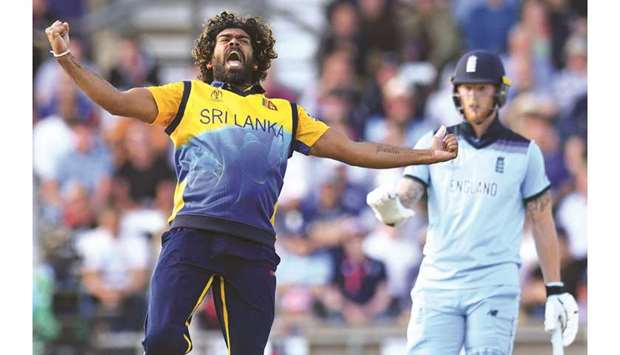 Sri Lankau2019s Lasith Malinga (left) celebrates after taking the wicket of Englandu2019s Jos Buttler (not pictured) as latteru2019s teammate Ben Stokes looks on during the 2019 ICC Cricket World Cup match at Headingley in Leeds, United Kingdom, yesterday. (AFP)