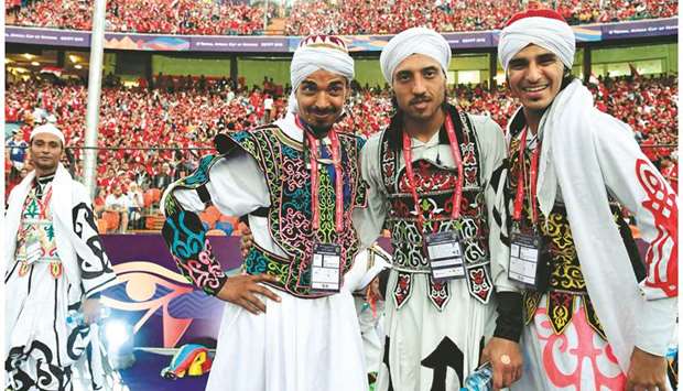 Fans pose for a picture ahead of the 2019 Africa Cup of Nations (CAN) football match between Egypt and Zimbabwe at Cairo International Stadium yesterday.