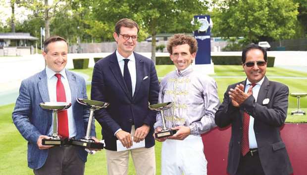 QREC Racing manager Abdulla Rashid al-Kubaisi (right) with the winners of the Qatar Coupe de France des Chevaux Arabes (Group 2 PA) after Meethag won the race at Chantilly yesterday. (JDG)