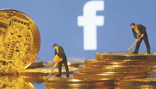 Small toy figures stand on representations of virtual currency in front of the Facebook logo in an illustration picture. Facebooku2019s decision to create its own digital money, with the grandiose ambition of establishing an alternative global financial system, is jumpstarting a long simmering debate in Washington over how to regulate cryptocurrency.