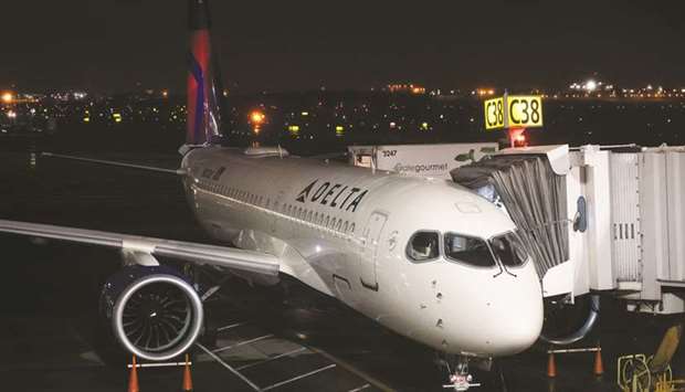 A Delta Air Lines Airbus 220 aircraft sits on the tarmac in the Queens borough of New York. The airline bought a small stake in Korean Air Linesu2019 parent company and said it wants to increase it to 10%, giving a boost to the management of South Koreau2019s top carrier that seeks to thwart a local activist fundu2019s challenge.