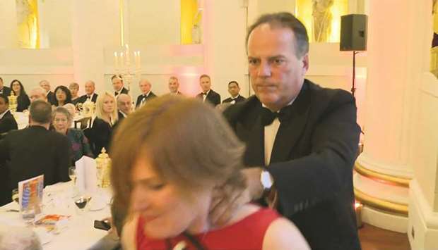 Video footage shows Conservative MP Mark Field tackling a Greenpeace climate protester at a dinner at Mansion House in the City of London.