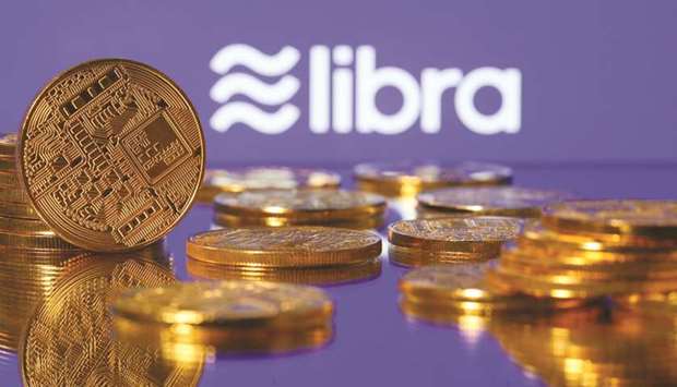 Representations of virtual currency are displayed in front of the Libra logo in an illustration picture.