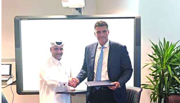 QFBA CEO Dr Khalid al-Horr and SUAS-Q executive dean Dr Ivan Ninov after signing the MoU.