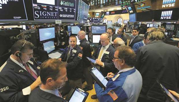 Traders work at the New York Stock Exchange (file). The S&P 500 was volatile on Friday as hopes of trade progress offset concerns about US-Iran tensions.